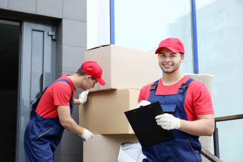 Brent moving team sorting recyclable packing materials during a sustainable move