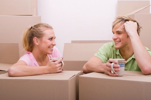 Moving boxes and furniture being handled by Brent movers