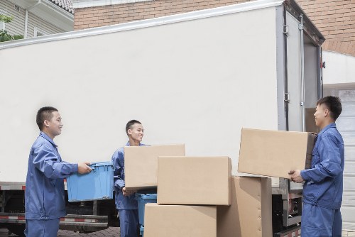 Packed office furniture ready for relocation in Brent