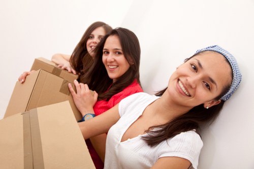 Packed moving boxes and furniture prepared for a house move in Brent