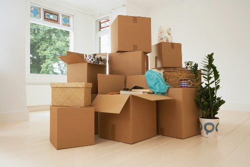 Unpacking boxes and arranging items in a new Brent home